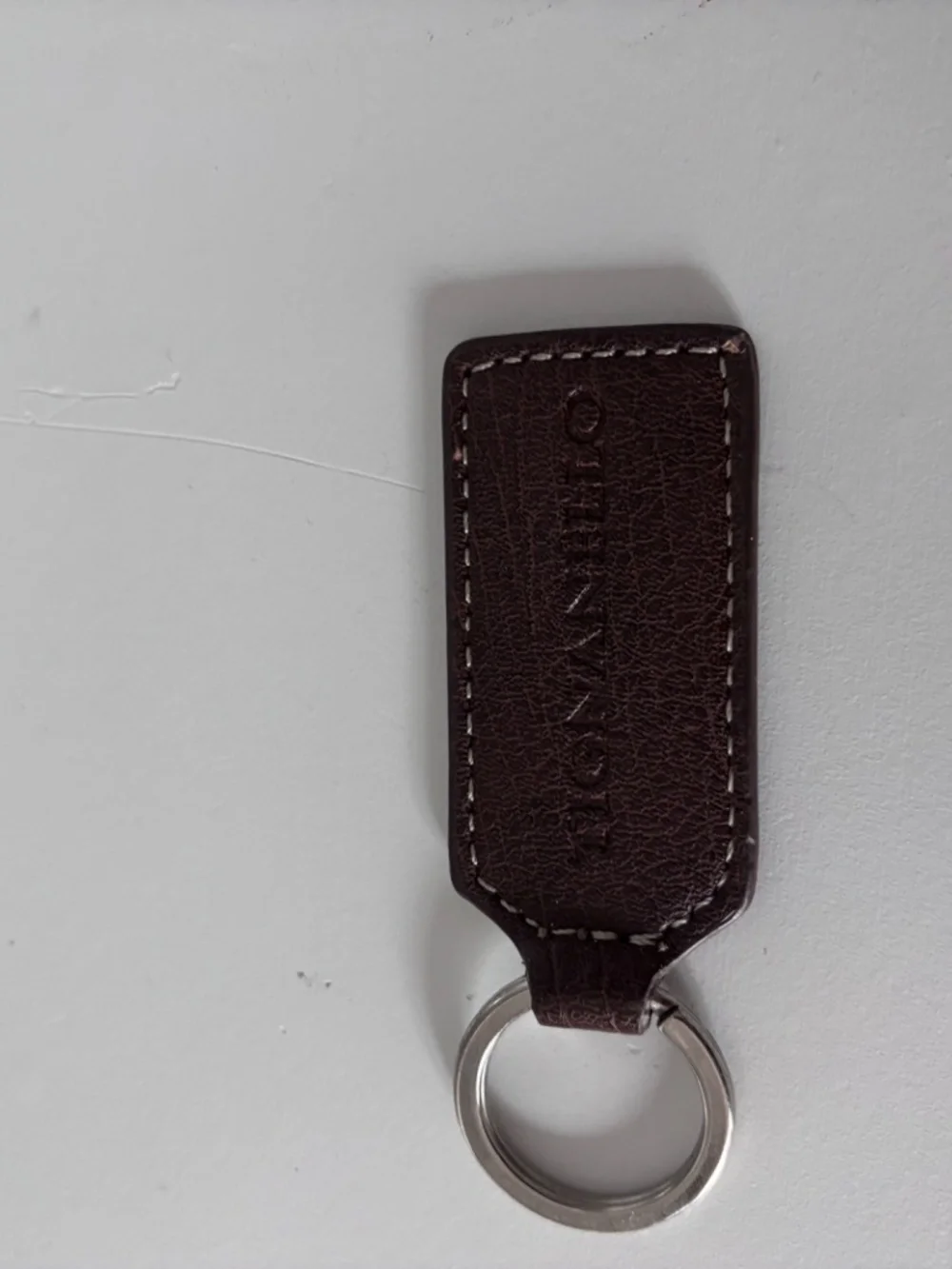 2 leather Tignanello keychains/bag charms